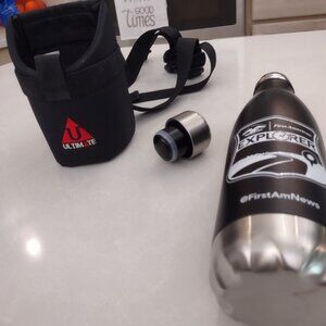 Aluminum water bottle with wearable holder. NWOT